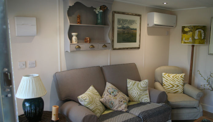 Sofa within Emmas garden office for her clients